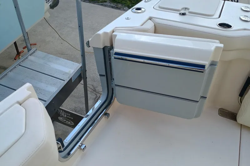 Slide: The Image of 2025 Grady-White Canyon 386 boat interior with open side door and seating. - 30