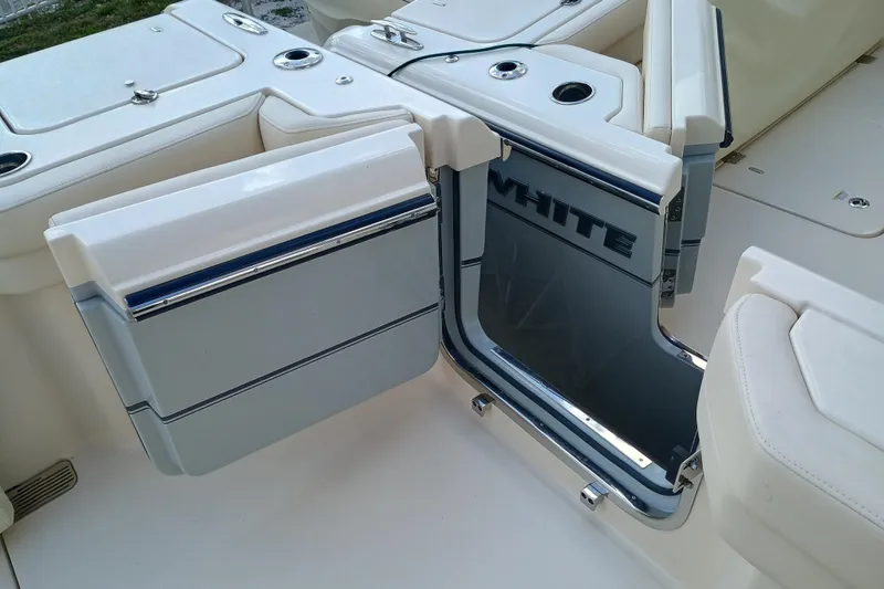 Slide: The Image of 2025 Grady-White Canyon 386 boat interior with open storage compartment. - 31