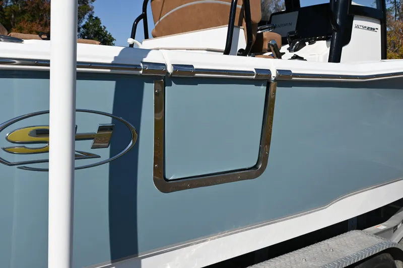 Slide: The Image of 2023 Sea Hunt Ultra 239 SE boat side view with logo and seating. - 22