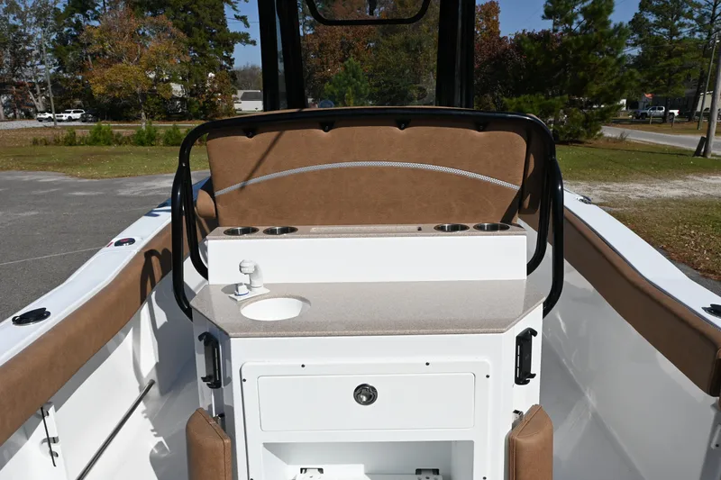 Slide: The Image of 2023 Sea Hunt Ultra 239 SE boat interior with seating and console. - 24