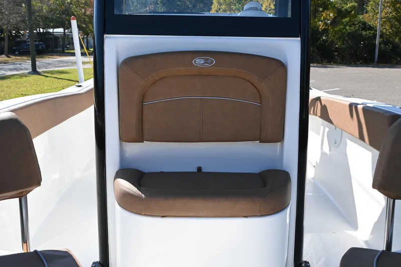 Slide: The Image of 2023 Sea Hunt Ultra 239 SE boat interior with brown seating. - 27