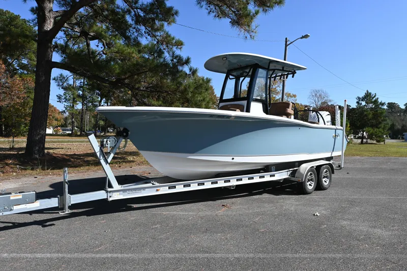 Slide: The Image of 2023 Sea Hunt Ultra 239 SE boat on trailer, parked outdoors. - 32