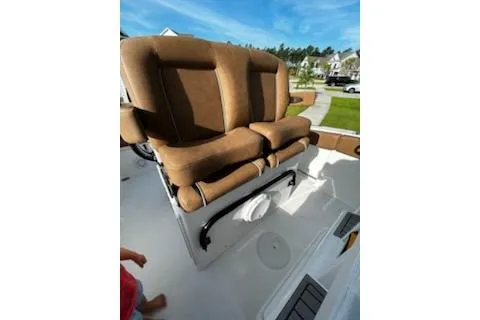 Slide: The Image of 2023 Sea Hunt Ultra 239 SE boat interior with modern dashboard and steering wheel. - 8