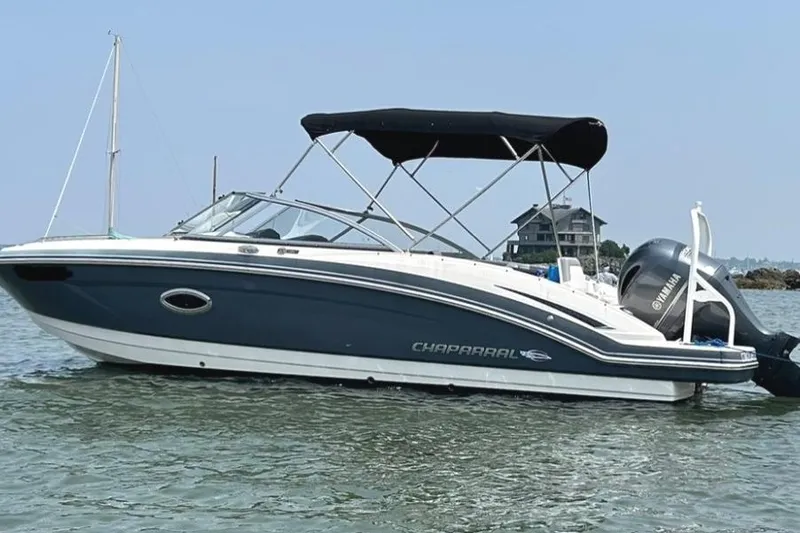 Slide: The Image of Chaparral 230 Suncoast 2021 boat with Yamaha engine on calm water. - 1