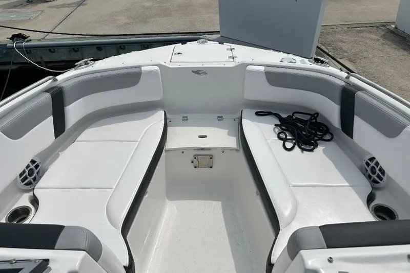 Slide: The Image of 2021 Chaparral 230 Suncoast boat interior with white seating and black rope. - 5