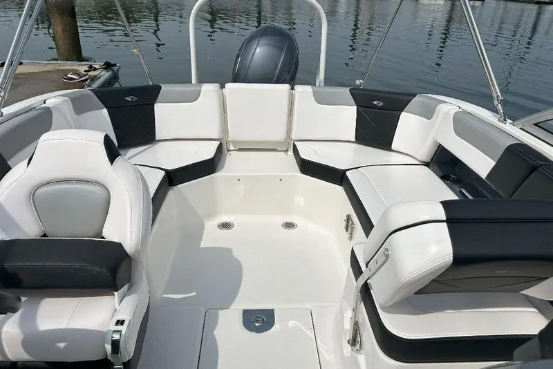 Slide: The Image of 2021 Chaparral 230 Suncoast boat interior with sleek seating and modern design. - 8