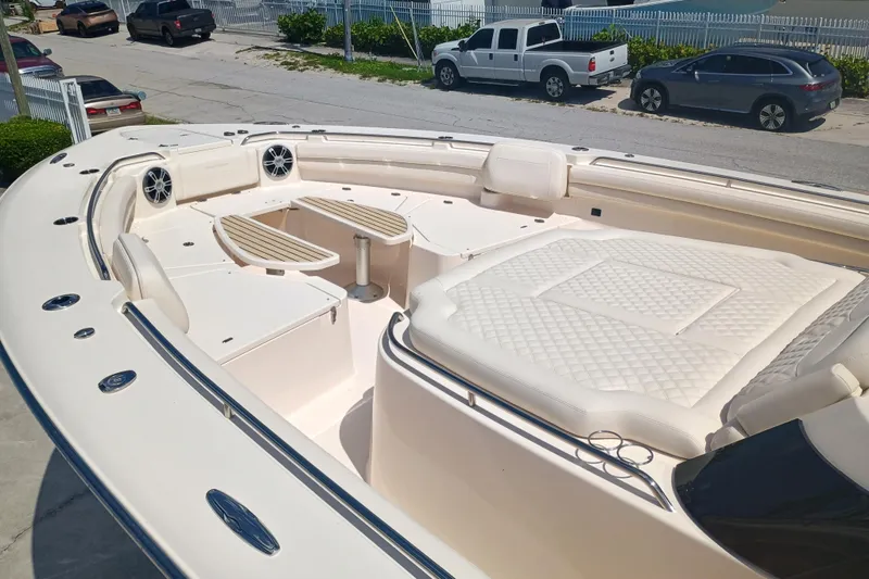 Slide: The Image of 2025 Grady-White Canyon 456 boat with spacious seating and luxurious deck design. - 17