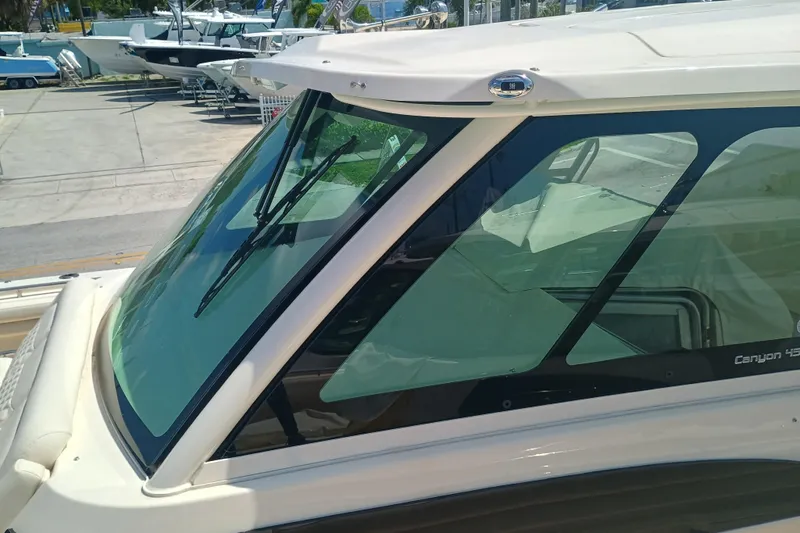 Slide: The Image of 2025 Grady-White Canyon 456 boat windshield, showcasing sleek design and modern features. - 18