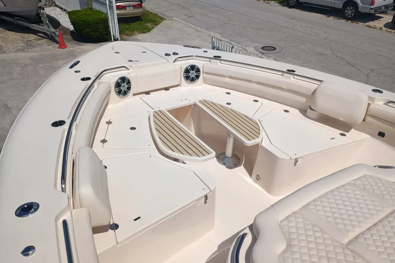 Slide: The Image of 2025 Grady-White Canyon 456 boat interior with seating and speakers. - 21