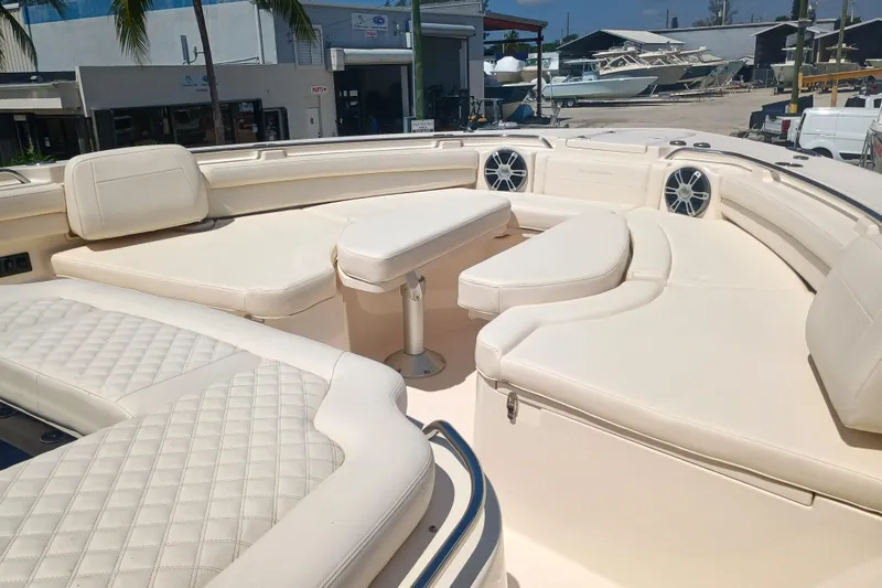 Slide: The Image of 2025 Grady-White Canyon 456 boat interior with luxurious seating and modern design. - 25