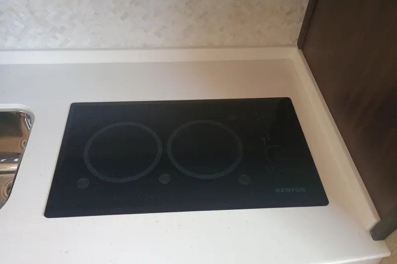 Slide: The Image of Kenyon cooktop on Grady-White Canyon 456 boat, 2025 model, sleek kitchen design. - 38