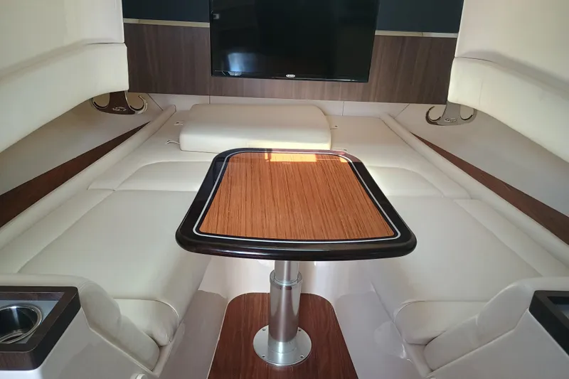 Slide: The Image of Luxurious interior of 2025 Grady-White Canyon 456 boat with elegant wood table and seating. - 39