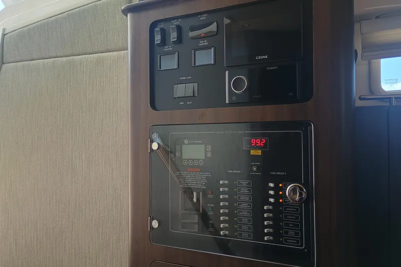 Slide: The Image of Control panel inside 2025 Grady-White Canyon 456 boat, featuring modern electronic systems. - 45