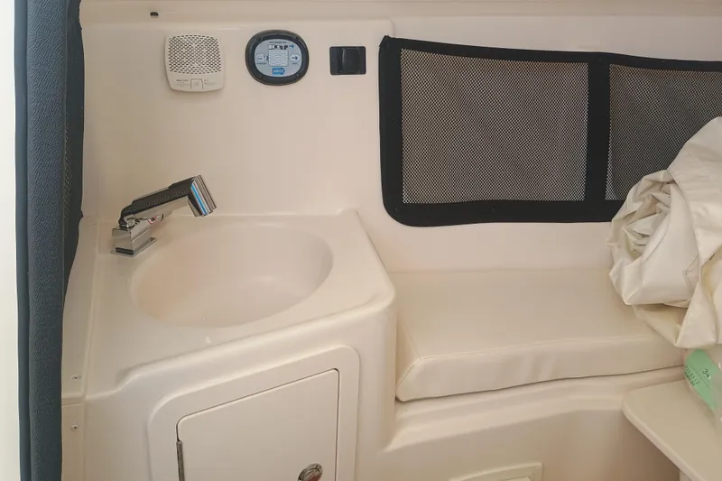 Slide: The Image of Interior of 2025 Grady-White Canyon 456 boat with sink and seating area. - 8