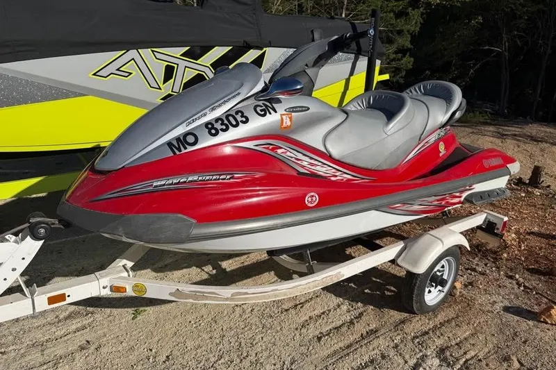 Slide: The Image of 2005 Yamaha WaveRunner FX Cruiser HO in red on a trailer, parked outdoors. - 0