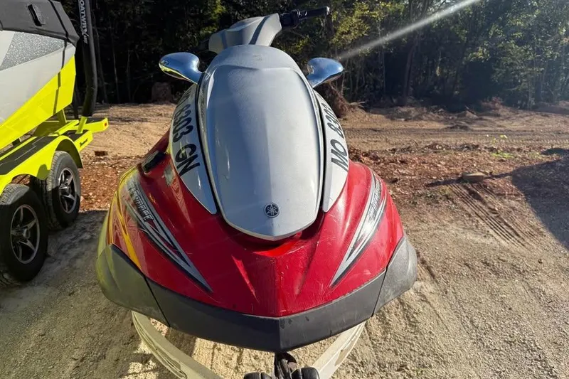 Slide: The Image of 2005 Yamaha WaveRunner FX Cruiser HO in red, parked on a dirt path. - 1