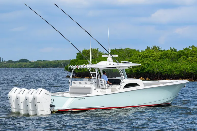 Slide: The Image of 2024 Valhalla Boatworks V-46 cruising on water with multiple outboard engines. - 10