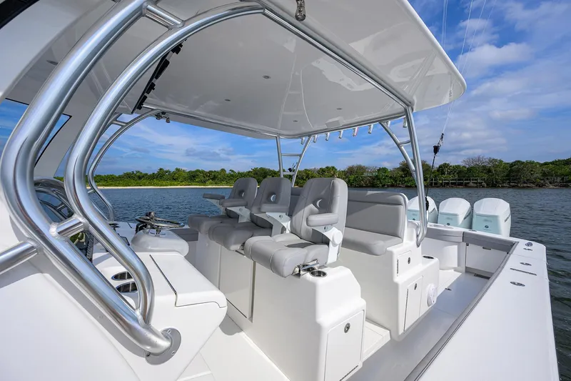 Slide: The Image of 2024 Valhalla Boatworks V-46 interior with sleek seating and modern design on the water. - 18