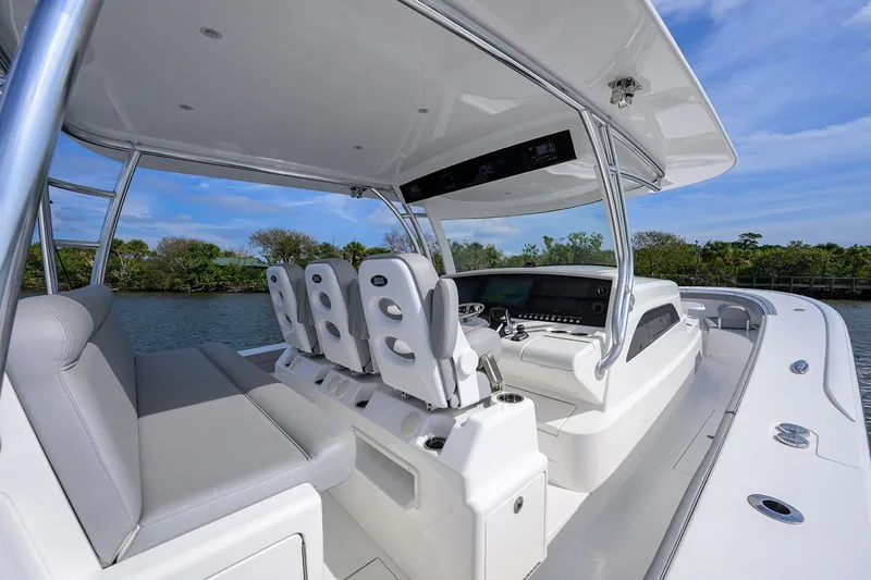 Slide: The Image of 2024 Valhalla Boatworks V-46 cockpit with modern seating and controls on a sunny day. - 20