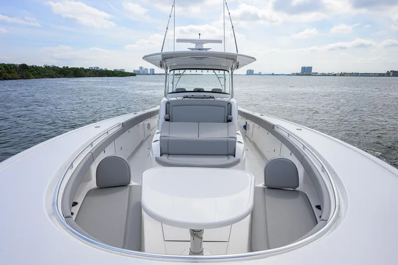 Slide: The Image of 2024 Valhalla Boatworks V-46 on calm water, showcasing sleek design and spacious seating. - 26