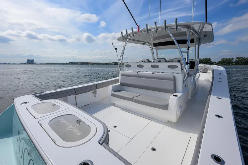 Slide: The Image of 2024 Valhalla Boatworks V-46 on water, showcasing spacious deck and seating. - 32