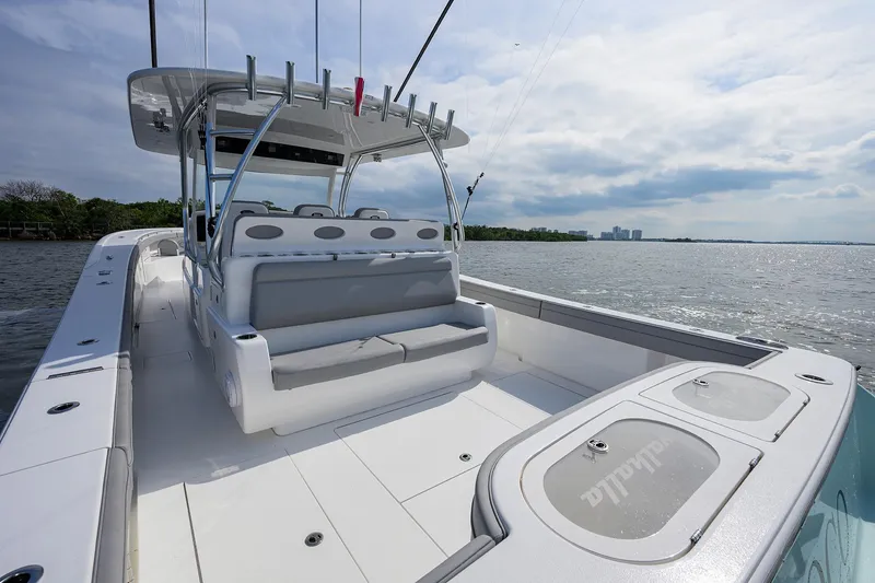 Slide: The Image of 2024 Valhalla Boatworks V-46 on water, showcasing spacious deck and seating. - 33