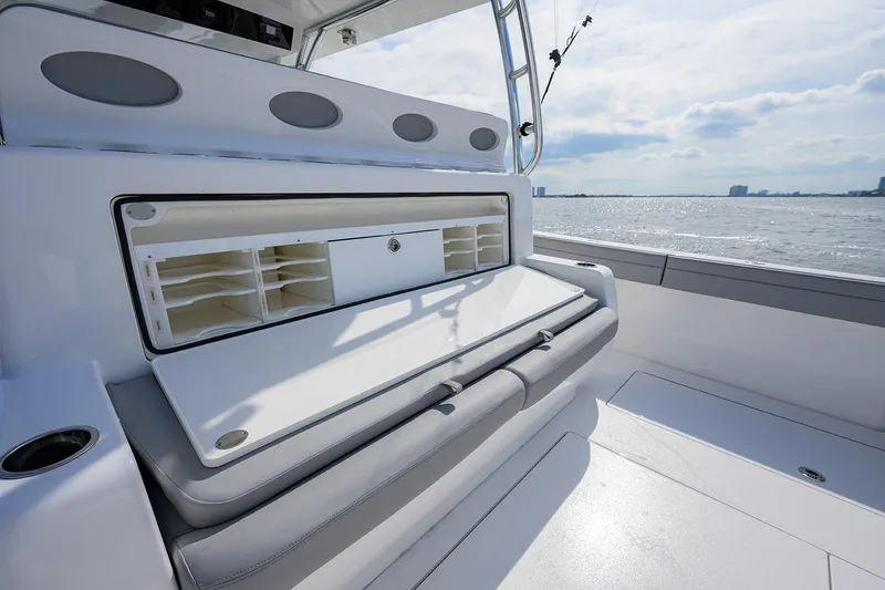 Slide: The Image of 2024 Valhalla Boatworks V-46 interior with storage compartment, ocean view in background. - 34