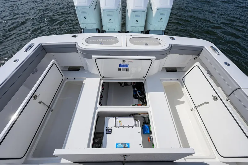Slide: The Image of 2024 Valhalla Boatworks V-46 deck with open storage compartments and engines. - 36