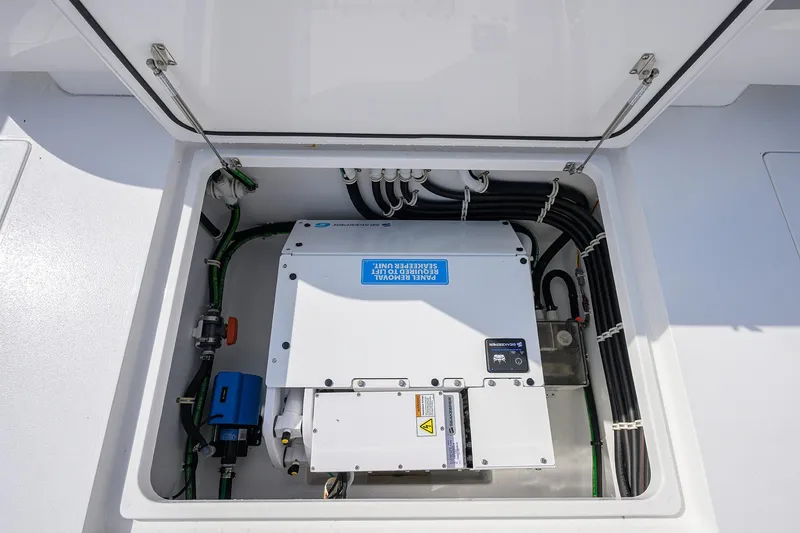 Slide: The Image of 2024 Valhalla Boatworks V-46 electrical compartment with wiring and control unit. - 38