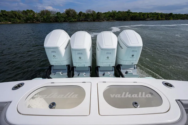 Slide: The Image of 2024 Valhalla V-46 boat with four Mercury outboard engines on water. - 42