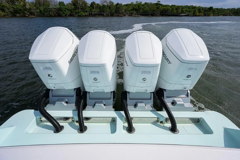 Slide: The Image of 2024 Valhalla Boatworks V-46 with four Mercury outboard engines on water. - 43