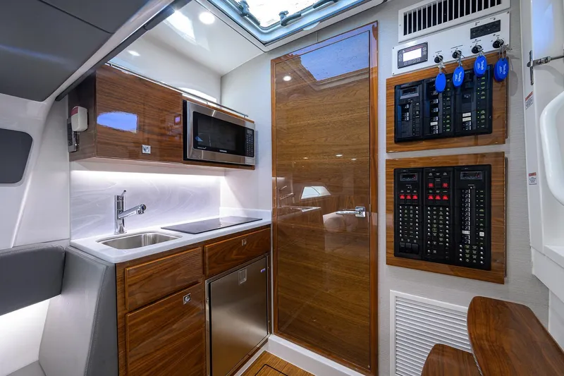 Slide: The Image of Luxurious 2024 Valhalla V-46 boat interior with modern kitchen and control panels. - 45