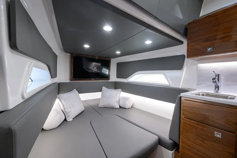 Slide: The Image of Luxurious interior of 2024 Valhalla Boatworks V-46 with modern seating and kitchenette. - 46