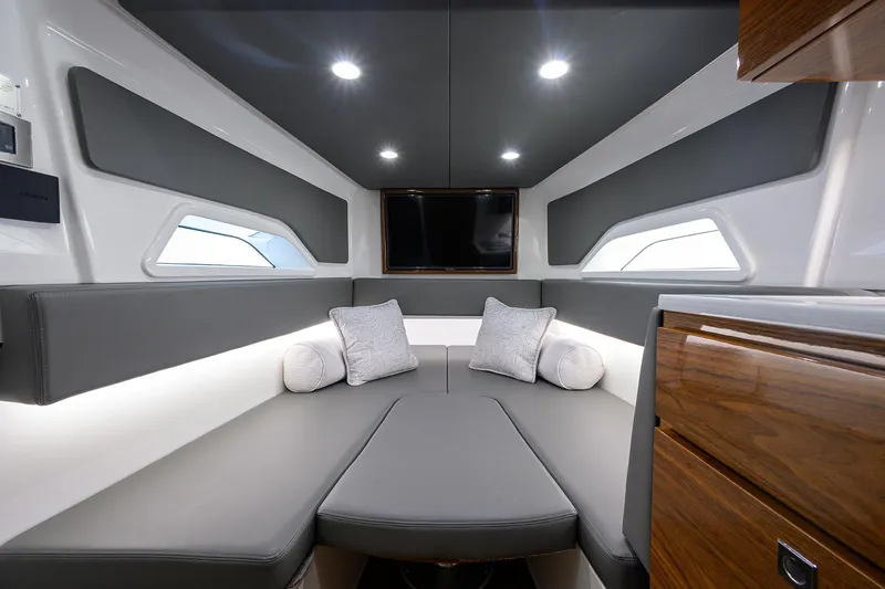Slide: The Image of 2024 Valhalla Boatworks V-46 interior cabin with modern design and comfortable seating. - 48