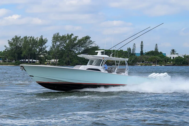 Slide: The Image of 2024 Valhalla Boatworks V-46 cruising on water, showcasing sleek design and powerful engines. - 6