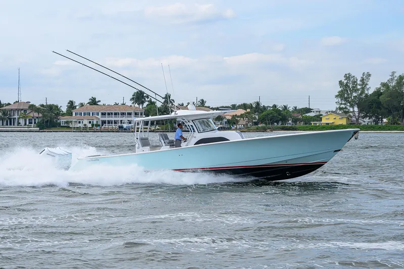 Slide: The Image of 2024 Valhalla Boatworks V-46 cruising on water, showcasing sleek design and performance. - 9