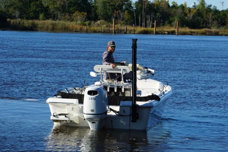 Slide: The Image of Bulls Bay 2000 boat on water, 2022 model, with person steering. - 4