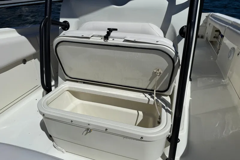 Slide: The Image of Open storage compartment on 2003 Hydra-Sports Vector 3300 CC boat, with ocean in background. - 10