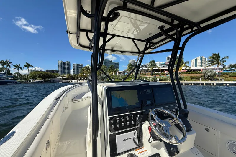 Slide: The Image of 2003 Hydra-Sports Vector 3300 CC boat dashboard with city skyline and palm trees. - 14