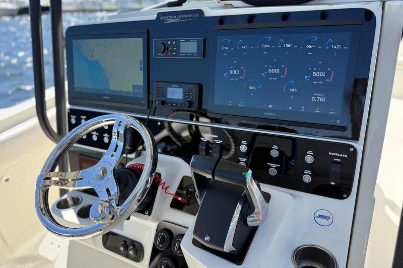 Slide: The Image of 2003 Hydra-Sports Vector 3300 CC dashboard with advanced navigation and control systems. - 15