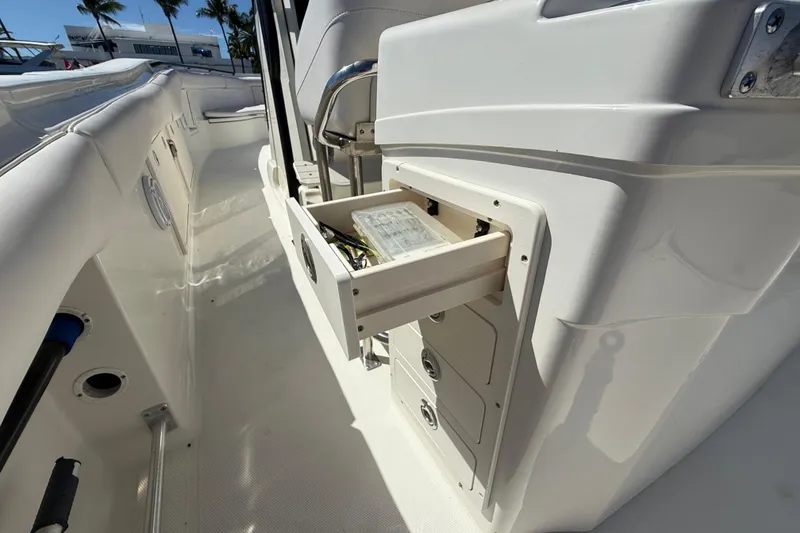 Slide: The Image of 2003 Hydra-Sports Vector 3300 CC boat interior with open storage compartment. - 17