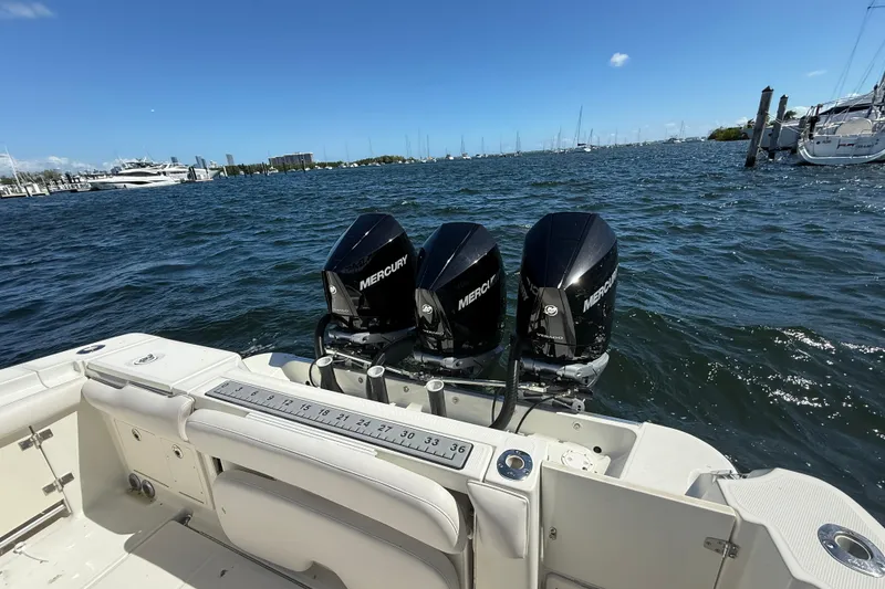 Slide: The Image of 2003 Hydra-Sports Vector 3300 CC with triple Mercury outboard engines on open water. - 18