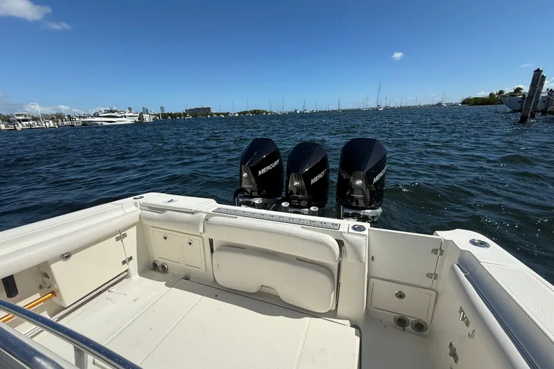 Slide: The Image of 2003 Hydra-Sports Vector 3300 CC boat with triple Mercury engines on open water. - 19