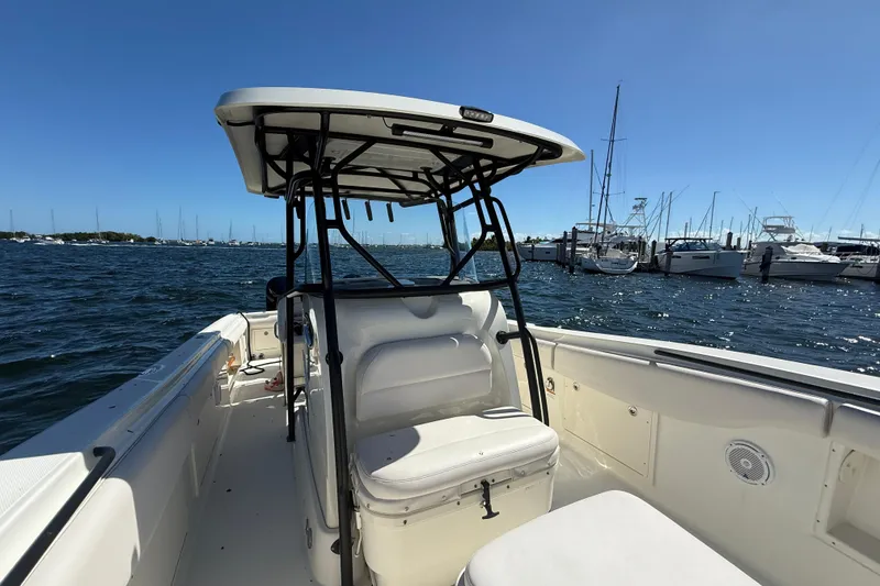 Slide: The Image of 2003 Hydra-Sports Vector 3300 CC boat on water, marina in background. - 21