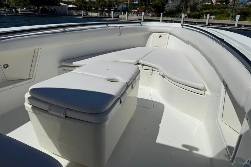 Slide: The Image of 2003 Hydra-Sports Vector 3300 CC boat interior with white cushioned seating. - 5