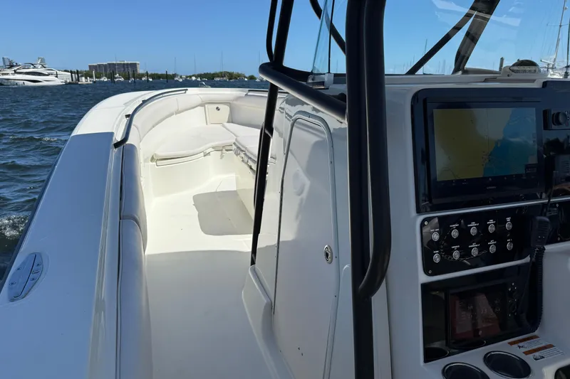 Slide: The Image of 2003 Hydra-Sports Vector 3300 CC boat interior with navigation system and seating area. - 6