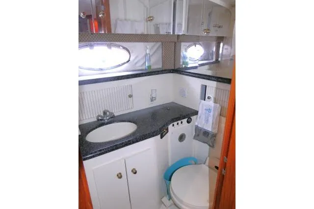 Slide: The Image of Bathroom interior of 2000 Carver 406 Motor Yacht with sink and toilet. - 13