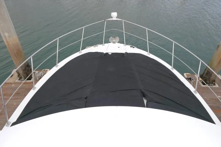 Slide: The Image of Bow view of 2000 Carver 406 Motor Yacht docked at marina. - 25