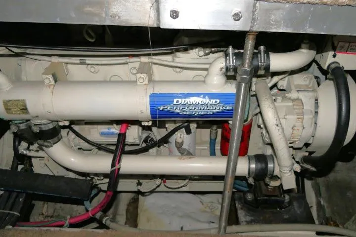 Slide: The Image of Engine compartment of a 2000 Carver 406 Motor Yacht, featuring Diamond Performance Series components. - 27
