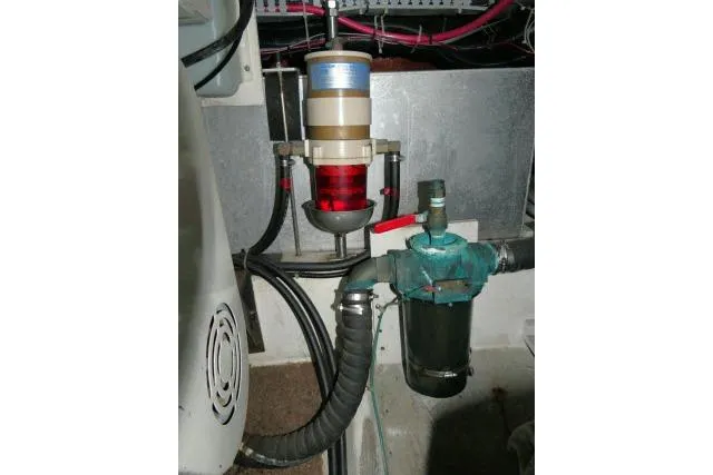 Slide: The Image of Engine room of 2000 Carver 406 Motor Yacht showing fuel filter system. - 28